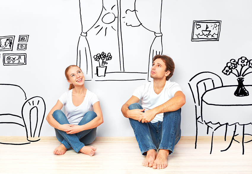 Concept family: Happy couple in the new apartment dream and plan interior